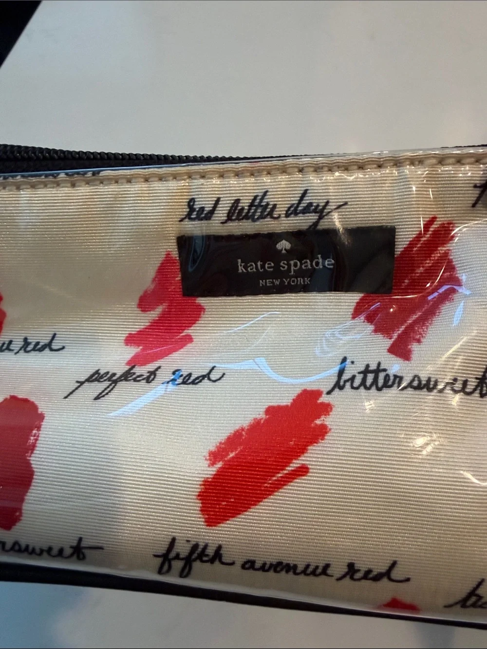 kate spade White Vinyl Cosmetic Case with Pink & Red Lip Prints